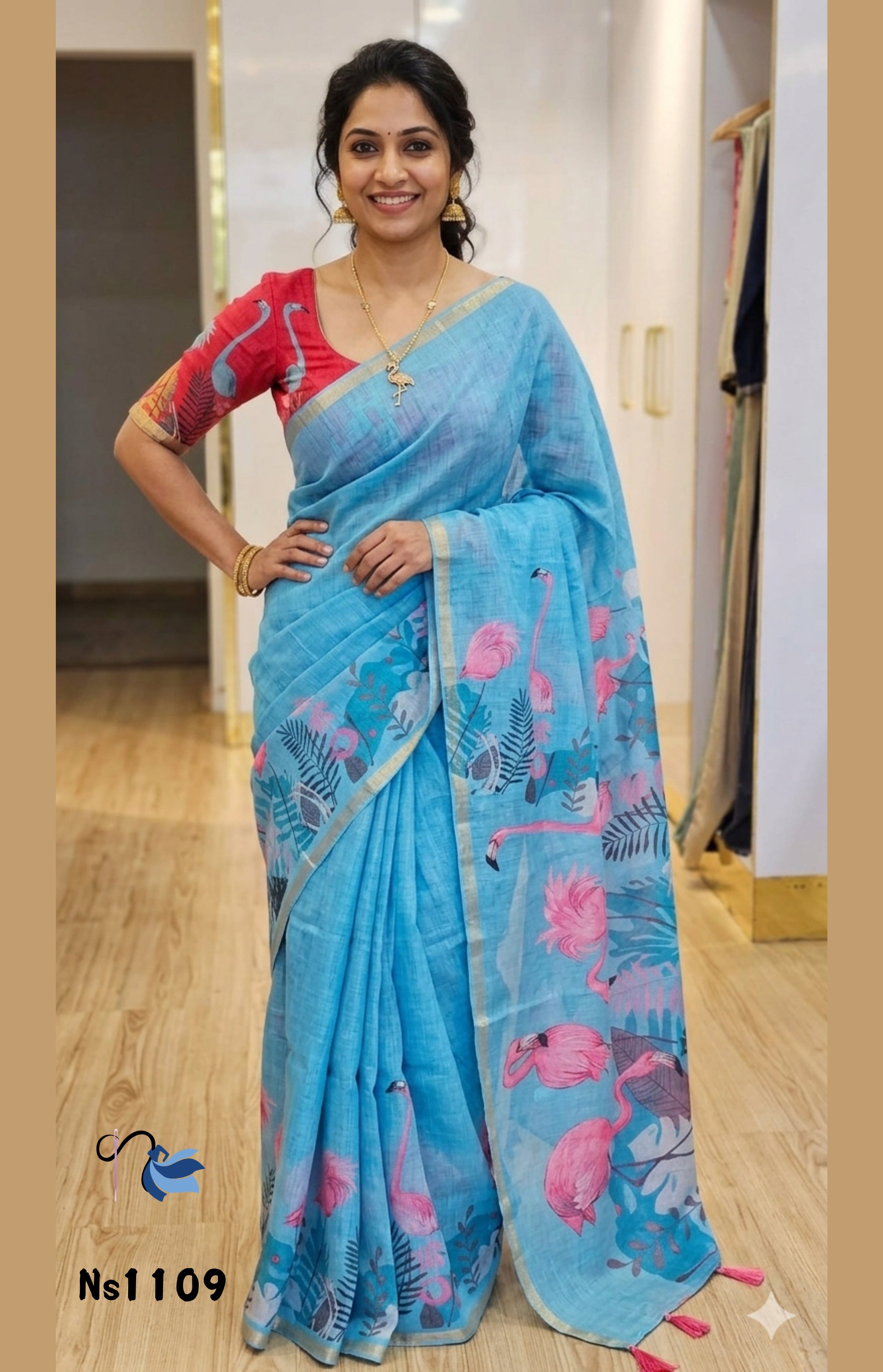 Woman wearing a blue saree with pink patterns indoors