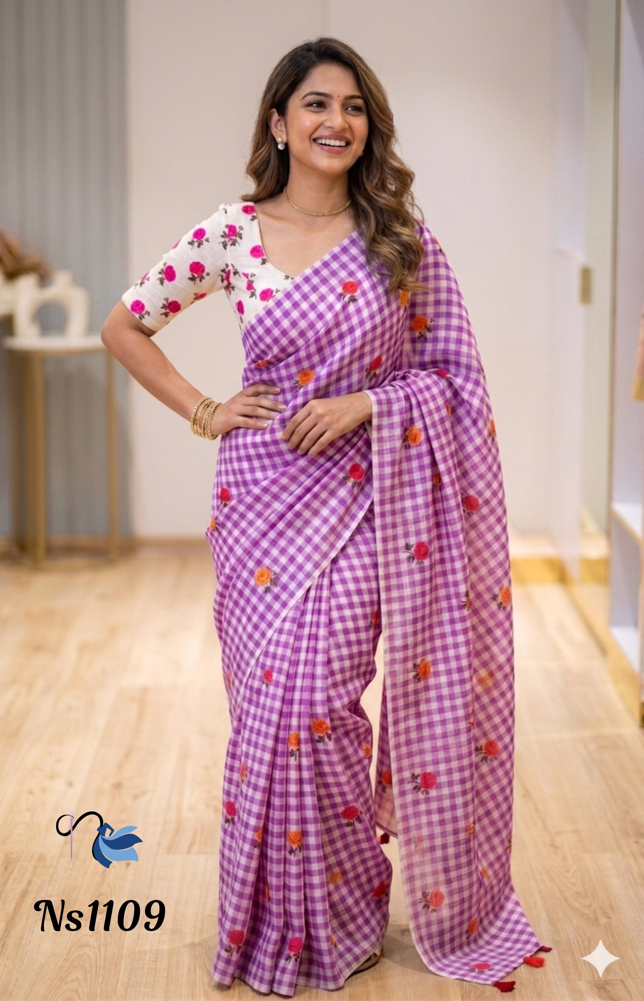 Model wearing a lavender purple and white gingham checkered saree from the Ns1109 collection, featuring pink and orange floral embroidery and a white floral blouse.