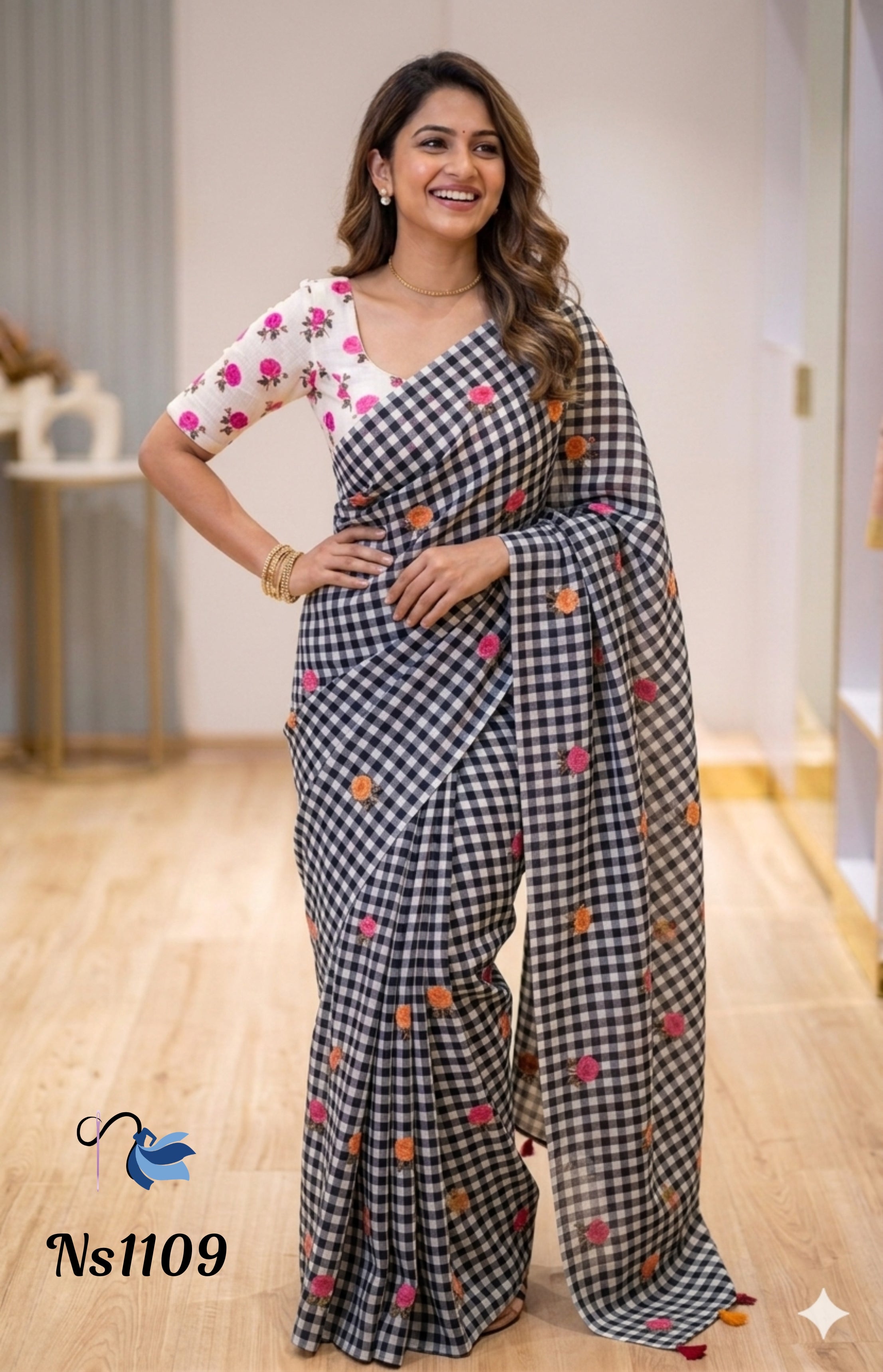 Woman wearing a checkered saree with floral patterns indoors